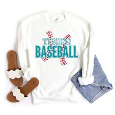 "Baseball Sweatshirt, Baseball Mom Shirt, Custom Baseball Shirts for Women, Personalized Baseball Sweater, Baseball Team Tees, Baseball Gift This custom baseball sweatshirt is so soft, comfy & stylish and perfect to keep you warm and cozy for baseball game day! HOW TO ORDER:  Please leave the team\\mascot name, and the font & font outline colors you would like in the \"Add your personalization\" text box. Please message me if you have any questions before ordering. This UNISEX sweatshirt will last for years. Good quality material that needs no ironing. All inks used to print are high quality, water-based and eco-friendly. 50/50 cotton/polyester 8.0 oz. fabric weight Reduced pilling and softer air-jet spun yarn All products are made-to-order. Colors may vary slightly from one computer/phone Long Sleeve Tops For Baseball Season, Varsity Screen Print Tops For Sports Season, Varsity Style Screen Print Tops For Sports Season, Long Sleeve T-shirt For College Baseball Season, White Varsity Sweatshirt For Baseball Season, White School Spirit Sweatshirt For Baseball Season, White School Spirit Sweatshirt For Sports Season, Varsity Long Sleeve Tops For Baseball Season, Team Spirit Long Sleeve Top With Lettering