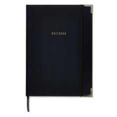 a black notebook sitting on top of a white table