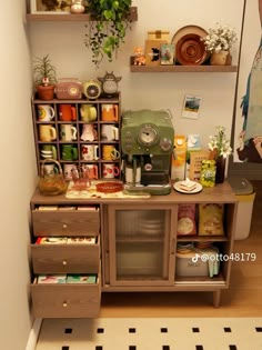 a shelf with many items on top of it in front of a mirror and potted plant