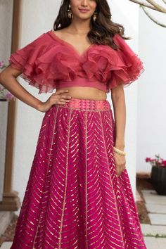 Hot pink organza choli with tiered ruffles. Paired sequin embroidered lehenga.
Components:2
Pattern:Embroidered
Type of Work:Thread work, Sequins
Neckline:V neck
Sleeve Length:Short sleeves
Fabric:Organza
Color:Pink
Other Details:
Geometric motif lehenga
Occasion:Wedding, Reception - Aza Fashions Party Wear Ruffled Organza Sharara, Elegant Ruffled Organza Sharara, Festive Organza Sharara With Ruffles, Organza Sets With Ruffles For Reception, Organza Ruffle Sets For Reception, Bollywood Style Ruffled Organza Dress, Organza Ruffles Sets For Reception, Bollywood Style Organza Dress With Ruffles, Wedding Lehenga With Ruffles In Organza