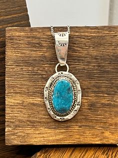 Main Stone:  Candelaria Turquoise Metal:  Sterling Silver Style:  Pendant Pendant Size: 3/4" x 1" Key Features: Turquoise pendant This beautiful turquoise pendant will be an exceptional addition to anyones jewelry collection!!  The stone is complimented by the gorgeous southwestern designed sterling silver and would be a great gift to that special someone, or treat yourself to it! Created in:  Manassa, Colorado Care instructions:   To prolong the life of your jewelry do not submerse in water, ap Rustic Silver Turquoise Necklace As Gift, Rustic Silver Turquoise Necklace As A Gift, Rustic Silver Turquoise Necklace For Gift, Rustic Blue Sterling Silver Jewelry, Rustic Nickel-free Blue Jewelry, Southwestern Untreated Turquoise Necklace, Untreated Southwestern Turquoise Necklace, Blue Turquoise Necklace With Large Chrysocolla Pendant, Blue Turquoise Chrysocolla Necklace With Large Pendant