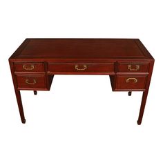 a wooden desk with two drawers and gold handles