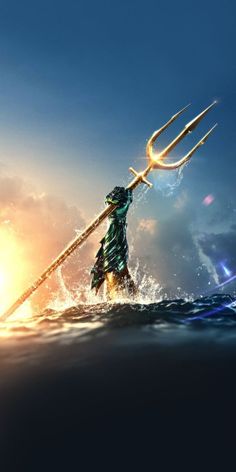 an image of a man holding a spear in the ocean with water splashing around him