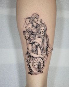 a black and white tattoo on the leg of a woman with an angel sitting on a wheel