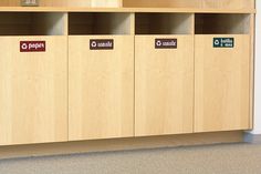 a row of wooden lockers with signs on them