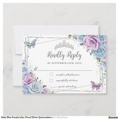 a wedding rsp card with purple and blue flowers on the front, and a white envelope