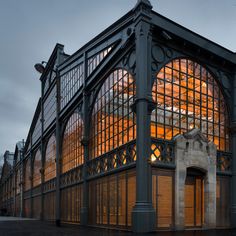 an old building with lots of glass on it