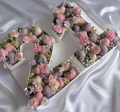 the letter s is made out of cupcakes and flowers