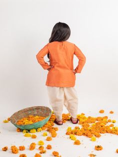 Orange chanderi emnbroidered yoke kurta set with dhoti pants. Color: Orange Fabric: Chanderi Note: The product will be delivered within 2-4 weeks of order placed Wash Care - Dry clean only No returns and Exchange. Measure before ordering to avoid any returns. Measurements: SIZE CHART FOR GIRLS Age CHEST ROUND WAIST ROUND KURTA LENGTH SLEEVE LENGTH BOTTOM LENGTH CHEST ROUND (ANGRAKHA) DRESS LENGTH (angrakha) LEHENGA BLOUSE LENGTH LEHENGA CHEST LEHENGA LENGTH 1-2 YEARS 24 17 17 14 19 20 17 10.5 23 Angrakha Lehenga, Angrakha Dress, Dhoti Pants, Lehenga Blouse, Orange Fabric, Kurta Set, Blouse Length, Pants Color, Color Orange