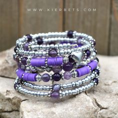 Amethyst: Amethyst is grounded in, tranquility, and calm. The literal meaning of Amethyst is “not intoxicated” -So wear bracelet this and party on! #gemstone #crystalhealing #gemstones #healingcrystals #healingstones #amethystjewelry #gemstonehealing #amethyststone #amethystgeode #birthstones #birthstonejewelry #februarybirthstone #birthstonenecklace #amethystring #amethystnecklace #jewelryaddict #bracelet #handmadejewelry Bohemian Purple Bracelets With Heart Beads, Bohemian Silver Heart-shaped Beaded Bracelets, Bohemian Silver Beaded Heart Bracelets, Bohemian Heart Beads Jewelry For Meditation, Rose Quartz Properties, Beaded Memory Wire Bracelets, Beaded Memory Wire, Amethyst Heart, Purple And Silver