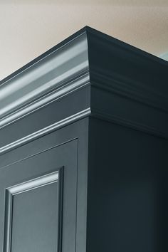 the corner of a cabinet painted gray