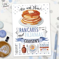 a poster with pancakes and crayons on it next to a cup of coffee