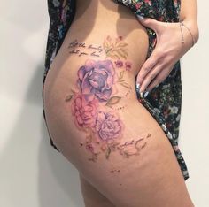 a woman's stomach with flowers on it and the words, love is in the air