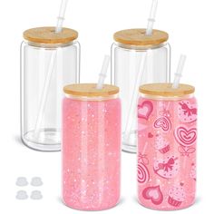 three glass jars with straw lids and wooden lids, one has pink glitter on the lid