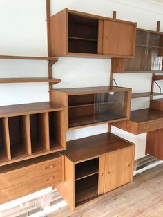 some shelves and cabinets in a room