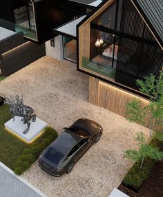 an aerial view of a car parked in front of a house