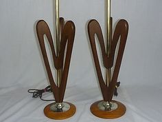 two wooden and brass colored lamps on stands