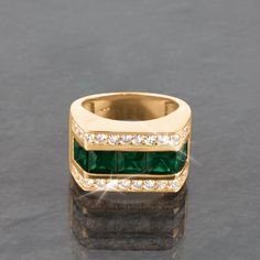 Five striking princess cut rich evergreen Daniel Steiger created Diamondeau®, our exclusive substitute for natural emerald, rest pride of place along the center, flanked either side by classic white gems. Making this a real conversation piece. A modern look he'll be sure to treasure. Man Wedding Band, Man Rings, Halo Engagement Ring Emerald, Green Princess, His Ring, Man Wedding, Mens Gemstone Rings, Man Ring, Men Rings