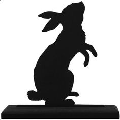 a black silhouette of a rabbit sitting on top of a block with the word bunny written below it