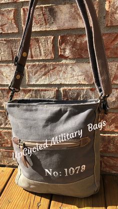 "Military Canvas Star Penna Crossbody Bag UpCycled, from re-purposed military canvas, tents & tarps. Perfect Medium Size Crossbody, vintage in appearance and says 1948 PENNA on the front and NO: 1078 on the back. Adjustable strap! Size Matters! Please check out these dims! 9\" W X 10.5\" H X 2\" W ZIP TOP CLOSURE BACK ZIPPED POCKET FULLY LINED - Brown Ticking 1 ZIPPED INSIDE POCKET 2 INSIDE POCKETS ADJUSTABLE STRAP View our entire crossbody section: https://etsy.me/35357GF We also have a CHE Military Style Bags With Pockets For Everyday Use, Military Style Everyday Bag With Pockets, Military Style Canvas Bags For Everyday Use, Military Style Canvas Satchel Bag, Military Style Canvas Bag With Pockets, Military Style Shoulder Bag For Everyday Use, Khaki Utility Canvas Bags, Military Canvas Shoulder Bag For Outdoor, Military Style Bags With Adjustable Strap For Daily Use