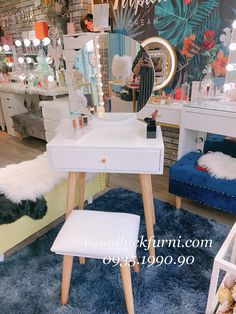 a white vanity table sitting on top of a blue rug