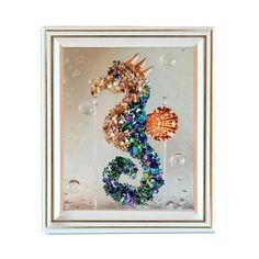 the seahorse is made out of glass and beads