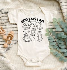 a baby bodysuit that says, god says i am