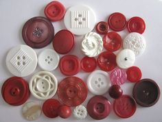 many different types of buttons on a white surface