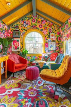 a brightly colored living room with floral wallpaper and colorful chairs, rugs and tables