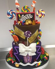 a multi layer cake decorated with candy and candies