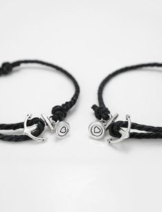 A set of 2 magnetic bracelets feature anchor charm, a truly special and meaningful gift to your loved one! The bracelet will wrap only once around your wrist and makes for a nice subtle accessory bringing out the outdoor and adventurous person in you. This could be a perfect friendship gift, couples anniversary gift, valentines gift, wedding gift. I T E M - D E T A I L S - 100% handmade - A set of 2 bracelets - magnetic closures engraved with initials - charm: silver anchor - rope finish: black, brown - adjustable knot: wrist sizes from 6.5 to 9.5 inches - fonts: standard, classic(by default), holy, cursive, kaufmann, old london H O W - T O - O R D E R 1. Select options from the dropdown menu 2. Add to cart and proceed to checkout 3. Submit your initials in the buyer¡¯s note section during Casual Black Jewelry For Best Friend Gift, Ldr Bracelets, Bracelets Heart, Magnetic Bracelets, Anchor Rope, Matching Couple Bracelets, Handwriting Bracelet, Bracelet Matching, Coordinates Bracelet