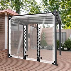 an outdoor room with sliding glass doors on the outside and wood flooring around it