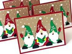 three christmas cards with santa claus on them