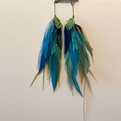 Very Colorful Blue And Green Saint Croix Adjustable Blue Feather Earrings, Blue Feather Earrings As Gift, Blue Feather Earrings Gift, Blue Feather Earrings For Gift, Elegant Blue Feather Earrings, Blue Feather Dangle Earrings, Peacock Crafts, Louis Vuitton Earrings, Extra Long Earrings