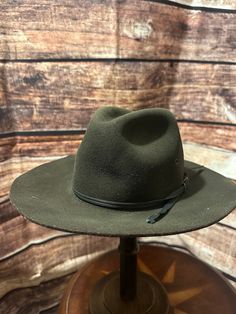 the brim is stiff and rough like a true cowboy hat should be. wool.. thsi hat is a custom hat, this hat is used, so is not in mint condition. but is really nice for the price. Rodeo Brimmed Fedora, Winter Hunting Fedora Hat, Winter Fedora Hunting Hat, One Size Brimmed Fedora For Rodeo, Vintage Felt Hat With Curved Brim For Outdoor, Country Style Wool Hat With Curved Brim, Green Short Brim Hat Bands For Rodeo, Green Hat Bands For Rodeo With Short Brim, Rustic Felt Hat With Curved Brim For Winter