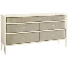 a white dresser with four drawers and two handles