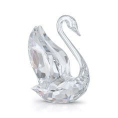 a crystal swan figurine on a white background