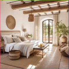 a bedroom with a large bed sitting next to a window in the middle of it