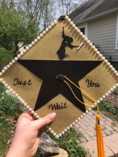 a hand holding up a graduation cap that says just one, you, and an arrow