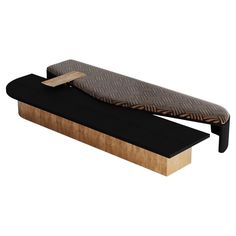 a wooden bench with black and brown fabric on it