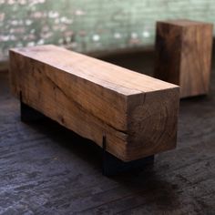 two pieces of wood sitting on top of a wooden floor