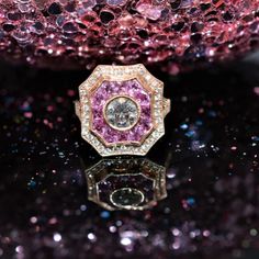 14K Rose gold Art Deco inspired ring set with a center 0.85 carat round center diamond having I color and VVS2 clarity, 12 French cut pink sapphires having a total weight of 1.5 carats, and 50 small diamonds having a total weight of 0.40 carats Champagne Ring, Rose Gold Art, Pink Sparkles, Gold Rings Fashion, French Cut, Gold Art Deco, Unique Gemstones, Gold Art, Art Deco Inspired