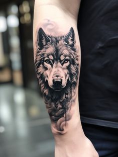 a man with a wolf tattoo on his arm