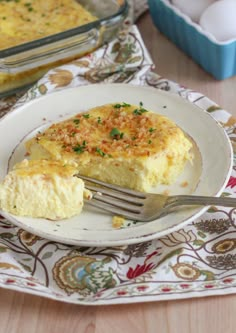 a plate that has some food on top of it with a fork in front of it