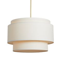 a white lamp hanging from a ceiling with a light fixture in the shape of a drum