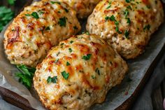 some meatballs with cheese and parsley on top