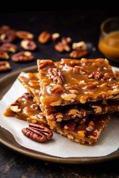 three pieces of pecan brittle on a plate