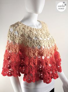 a white mannequin wearing a red and beige crochet top