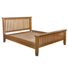 a wooden bed frame with slatted headboard and foot board