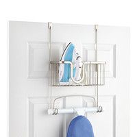 an ironing board is hanging on the wall next to a blue surfboard and towel rack